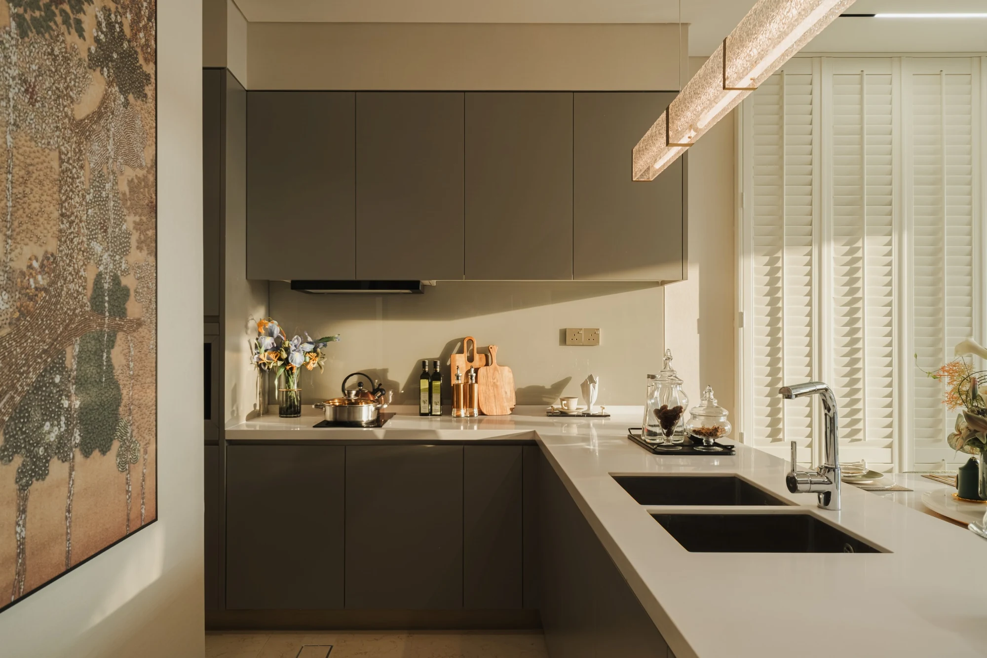 Kitchen cabinets and sink in a Cappella Embassy show unit