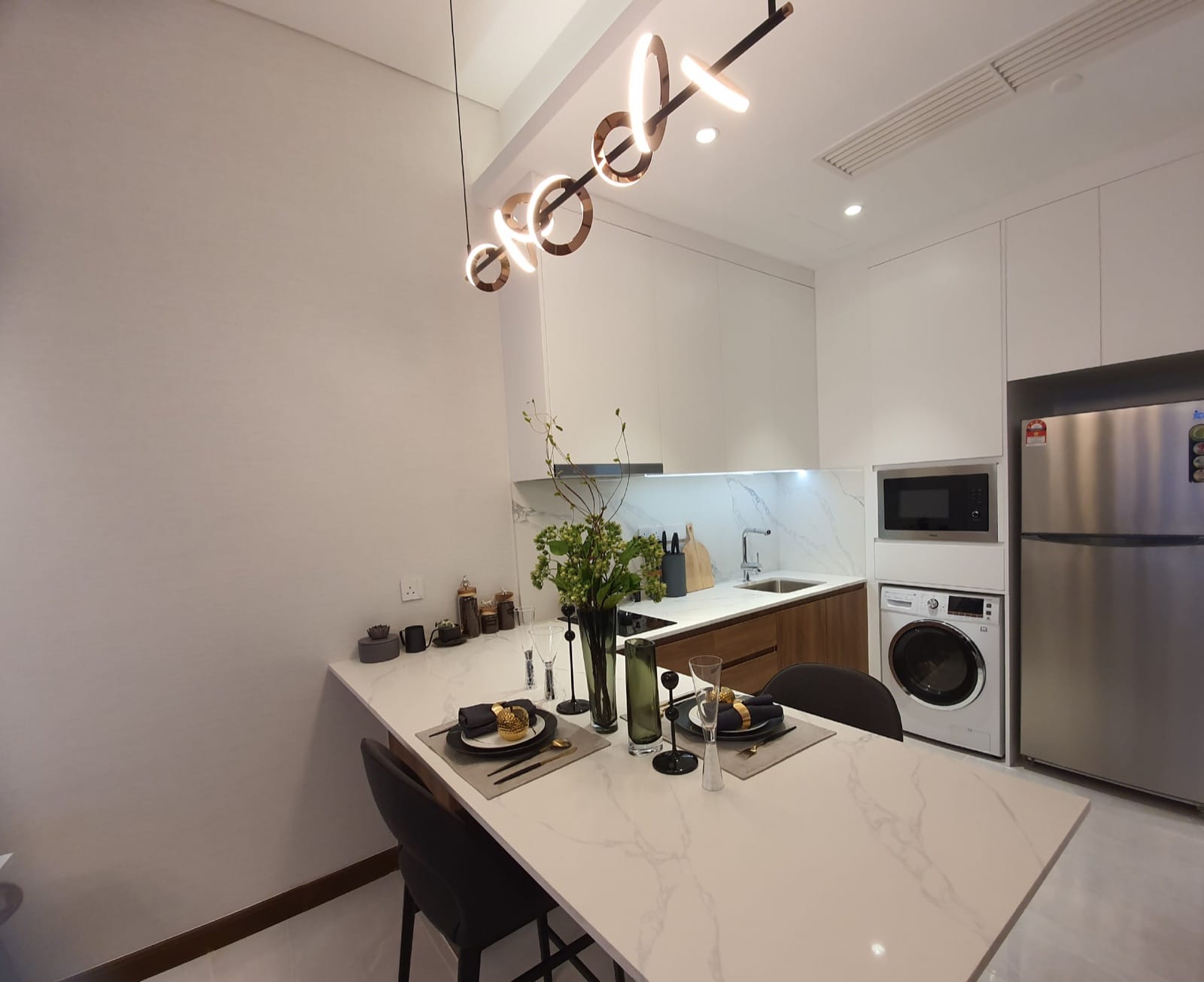 Core Residence TRX show-unit dining and kitchen, photographed December 2019