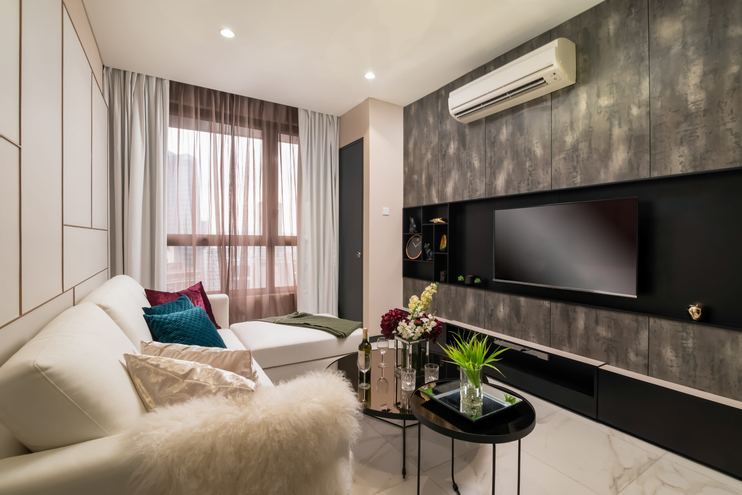 Living area in a developer-supplied photograph of a 1+1 suite at Wyndham Suites KLCC